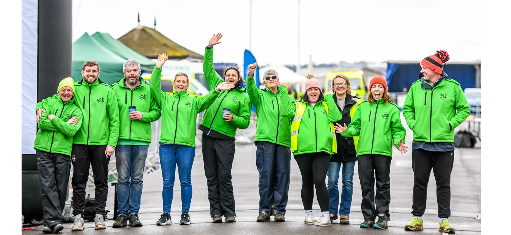 Nice Work event organisers wearing green jackets